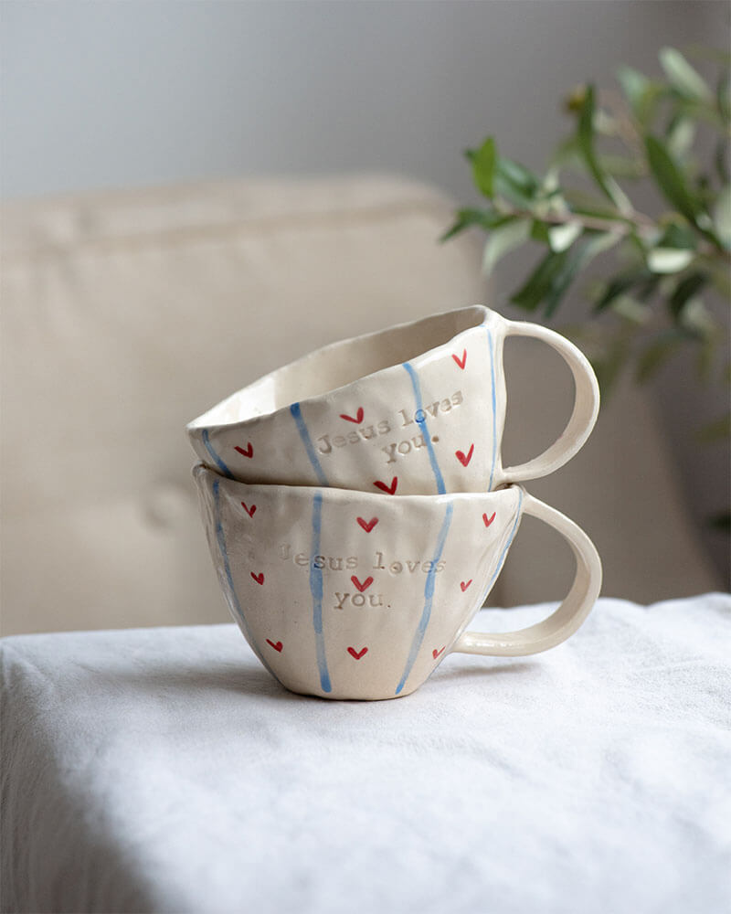 blue and red Jesus Loves you mug